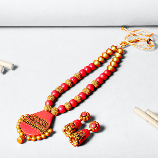 Hansa's Handcrafted coral and gold terracotta necklace set
