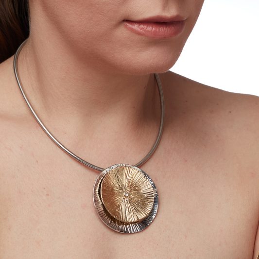 RIAS Dual-Tone Sunburst Pendant Necklace for Women