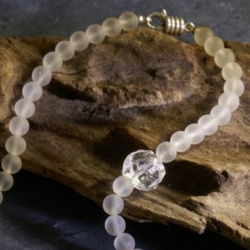 A sharp, focused macro shot of the premium 925 Sterling Silver magnetic clasp on the Crystal Mala, clearly displaying the hallmark of authenticity for fine jewelry.